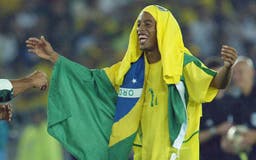 <p>Brazilian midfielder Ronaldinho celebrates the victory of his team, 30 June 2002 in Yokohama, Japan, after the final of the 2002 FIFA World Cup between Brazil and Germany. Brazil won the final 2-0. AFP PHOTO &#8211; Patrick HERTZOG</p>
