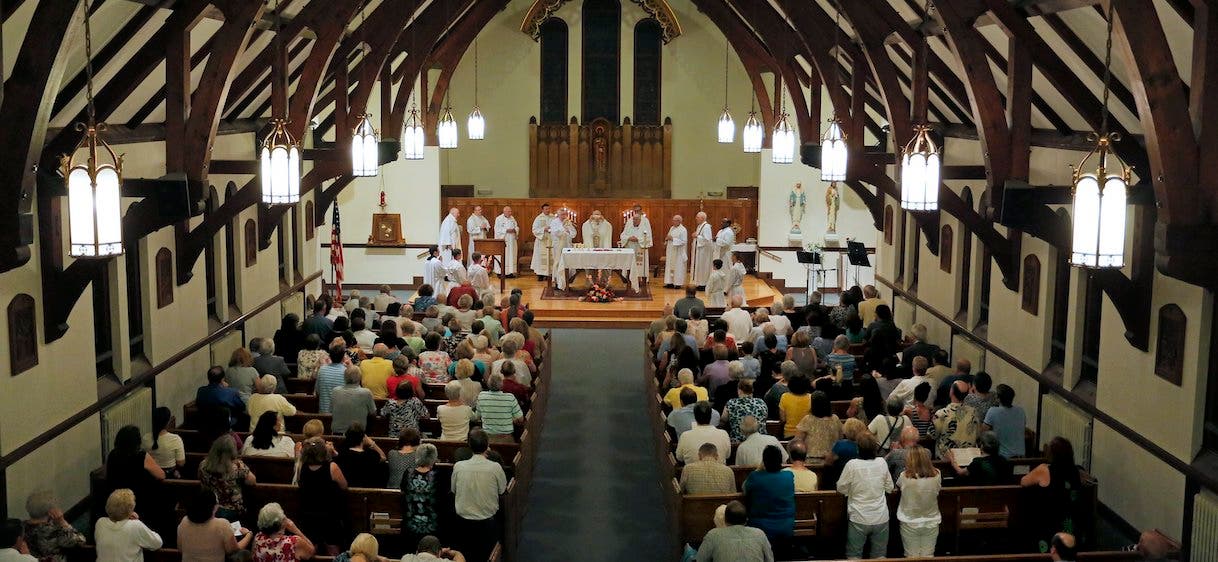 <p>Gabe Souza/Staff Photographer<br />
Parishioners at St. John the Evangelist Catholic Church in South Portland celebrated their last mass their Wednesday night, September 11, 2013. The church will merge with Holy Cross, also in South Portland, and the building will be sold.</p>
