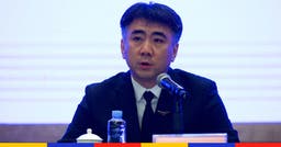 <p>Zhu Tao, directeur du département des normes de vol de l&#8217;administration de l&#8217;aviation civile chinoise en conférence de presse (© Noel Celis / AFP)</p>
